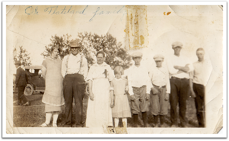 The Ole K Flateland family on or about July 11, 1925, the occasion of Ole & Anna's 25th wedding anniversary. L-R: Birgit, Ole K, Anna, Lola, Ted, Oscar, Knute, Ole Flateland.