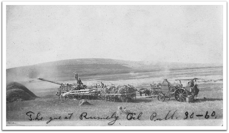 George Reitter's Rumely Oil Pull 30-60 tractor in action powering a threshing machine in the vicinity of Goodrich, North Dakota, late 1910s.
