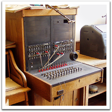 A telephone plugboard for connecting calls,  similar to the ones that Leona & Helen would  have worked on in the 1930s.  Note the hand crank on the lower right.