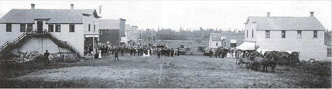 Main street of Trail, Minnesota, looking north, July 3, 1915.  The large building on the left was known as the P.G. Peterson building in later years  and the building on the right was Dahl’s store.