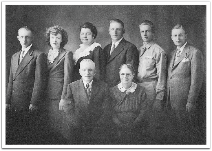 Not too long after enlisting, Oscar, in uniform, joined the rest of his family  for this portrait while on leave, probably taken at a studio in Grand Forks, North Dakota.  L-R, back: Ted, Lola, Birdie, Knute, Oscar, Ole; front: Ole & Anna.