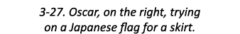 3-27. Oscar, on the right, trying on a Japanese flag for a skirt.