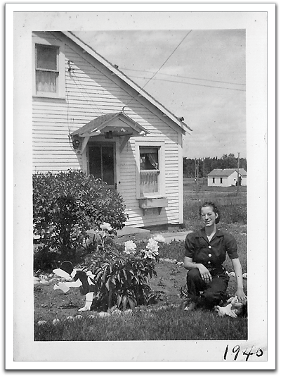 Helen with Pegs in front of the Reitter house, perhaps a "back to school" picture late in the summer before departing for college in Bemidji.