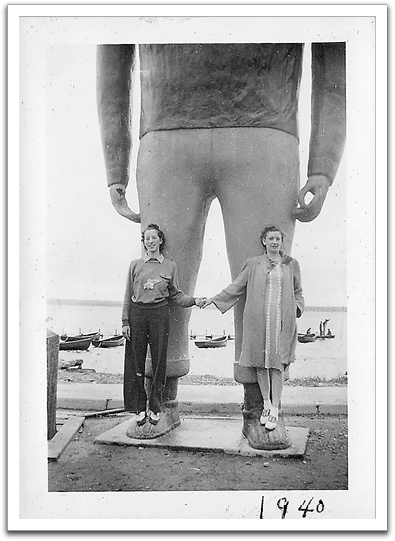 Helen with a friend in front of the Paul Bunyan  statue in Bemidji, perhaps near the beginning of  her first year in college. Apparently, the social prohibition against women wearing slacks was beginning to loosen by then.