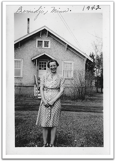 Maggie in front of the house where Helen  was staying while in college in Bemidji.
