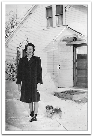 Helen in front of the house in Trail  with Pegs.
