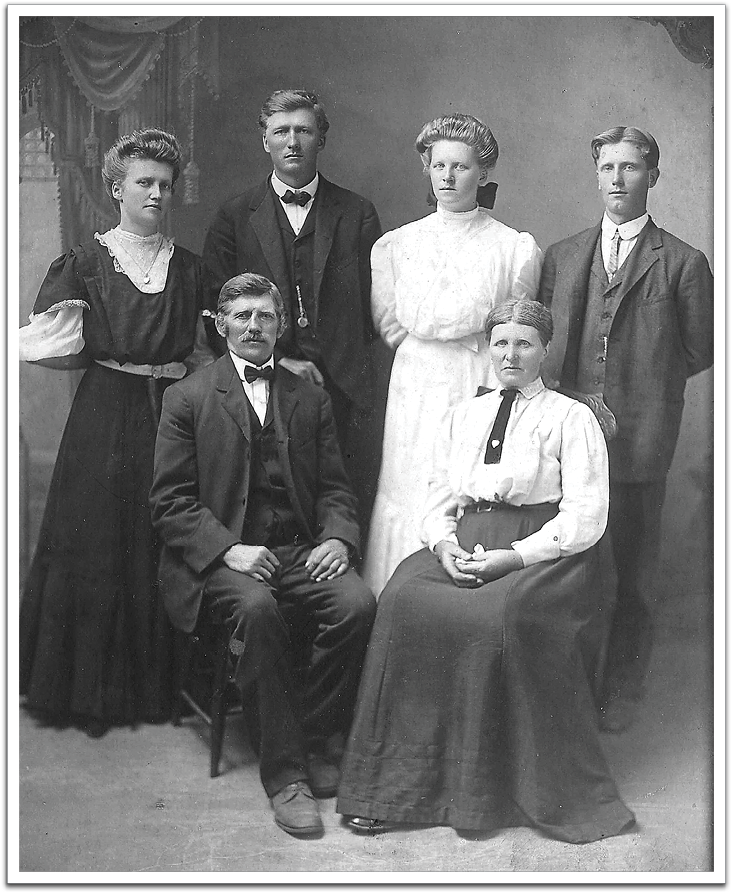 Kjetel and Torbjorg Rygnestad (front) and family, circa 1900-10, probably in Grand Forks, North Dakota. Torbjorg was Ole K Flateland's older sister and the oldest of his siblings.