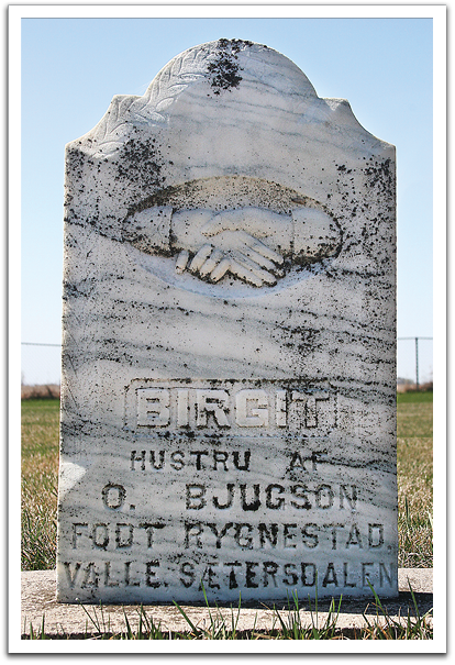 Gravestone of Birgit Sigurdsdottir Sagneskar (Rygnestad), born 1846 near Valle, Setesdal, Norway. Photo by Byron Flateland in 2006 in West Valle Cemetery near Trail, Minnesota.  Birgit was the mother of Anlaug Flateland.
