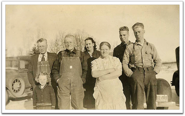 L-R: Ole Gunderson and daughter Audrey, Ole K, Etta & Anna Flateland, Marvin Tinnesand, Oscar Flateland. This photo was likely taken in the fall of 1941, just months before Marvin and Oscar enlisted in the Army in 1942.