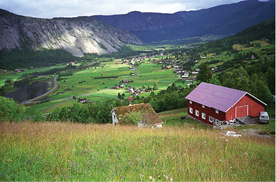 This photo, made by Byron Flateland in 1996, looks north over the village of Valle, and illustrates the challenging lay of the land surrounding the Setesdal Valley.