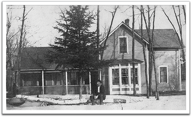 John Fredrick Reitter in front of his house on the farm, probably  between 1910 and 1920, in Sheridan County, ND.