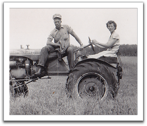 Oscar & Helen on "Allis,” their Allis-Chalmers Model C tractor.