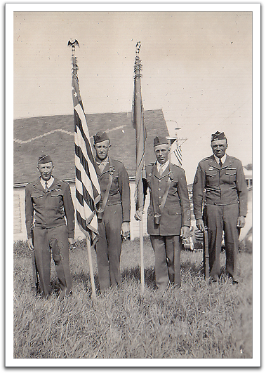 Norris Brekke, Alton Schmunk, Oscar Flateland, and Philip Schmidt in uniform, probably on Memorial Day, about 1950.