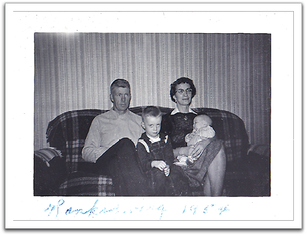 Celebrating Thanksgiving, 1954, at the Van Tassels:  Oscar, Byron, Helen, Myles. Apparently, Byron was less than enthusiastic about being in the photo.