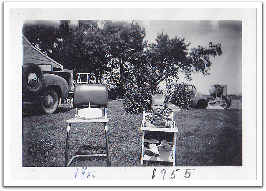 Myles on his first birthday, August 16, 1955,  in the yard in front of the house.