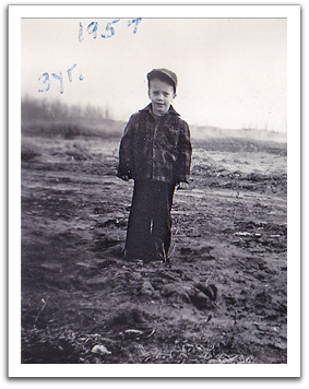 Myles on his 3rd birthday,  August, 1957. It looks like it may  have been a cool wet year.
