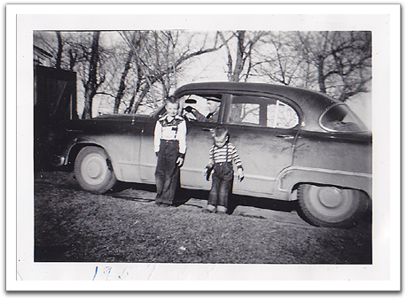 Byron and Myles in front of the family car, a 1949 Dodge,  which Oscar had bought as a used car a few years before.  Photo probably taken in the fall of 1957.