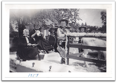 Byron & Joyce Nelson in foreground, riding on Trail's float in the 1958 Minnesota centennial celebration.  Mrs. Handy and two other unidentified ladies are sitting in the back.