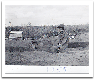 Byron in the hole,  Myles sitting, spring, 1959.