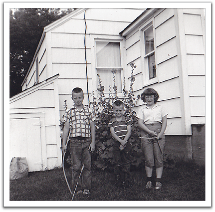 Byron, Myles, and Sharon Swanson, summer, 1960,  after a rousing game of "Cowboys and Indians,”  on one of Sharon's visits from Fosston.