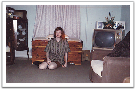 Jill in the living room of the family's home above the Soo Line Depot in Oklee.