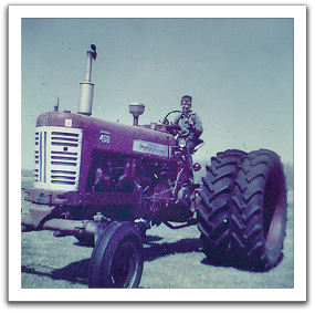Myles on tractor, 1967 or so.