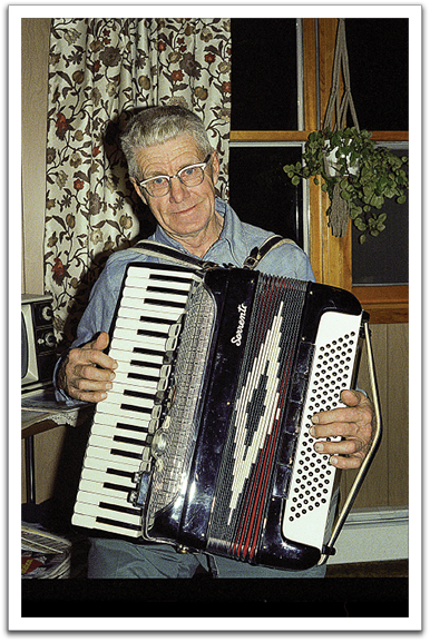 Oscar with his accordion, Christmas, 1979, Oklee.