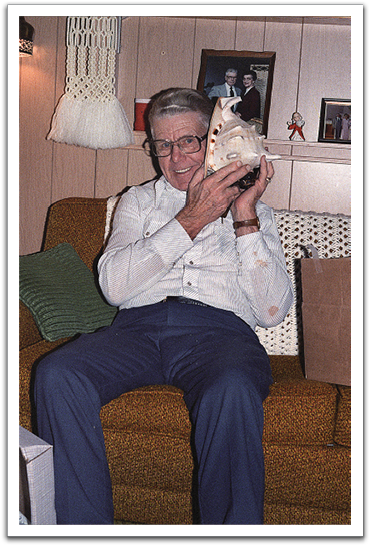 Oscar, pretending to hear the sea in the shell, December 1985, Oklee.