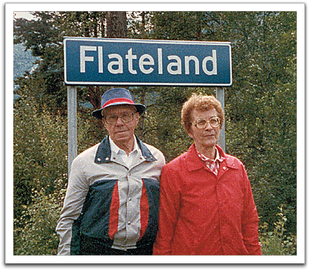 Oscar & Helen in Setesdalen standing in front of the sign  at the edge of the Flateland area.