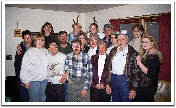 Some of the family members that attended Knute’s funeral, April 1997, Knute’s house.  Members ID’d by relationship to Knute: Front, L-R: Roxanne Flateland, great-granddaughter; Olin, Allen (Butch), & Annette, sons & daughter; Oscar Flateland, brother; Chelsi Flateland, granddaughter.  Middle, L-R: Janet Flateland, granddaughter; Bradlee, son; Lori & Kathleen Larson, granddaughter and daughter; Tena & Jason Flateland, granddaughter & grandson.  Back, L-R: Janet Flateland, granddaughter; Margaret Flateland, daughter-in-law; Joyce Flateland, granddaughter; Jennifer Nelson, granddaughter; Jarrod Larson, grandson.