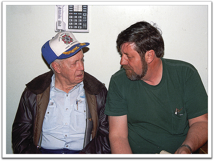 Oscar having a chat with nephew Bradlee, Knute's son, after Knute's funeral, April 1997.