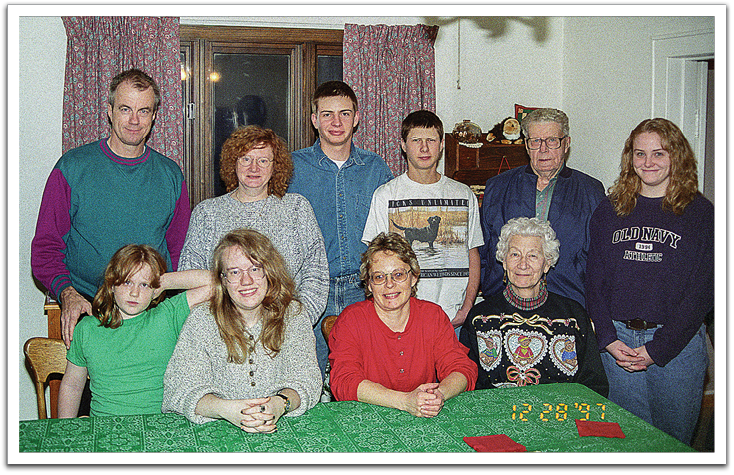 Front: Crystal, Kirsten, Bonnie Wishard, Leona Brekke.  Back: Byron, Jill, Dudley & Buster Wishard, Oscar, Cindy Wishard, December 1997, Bonnie’s house.